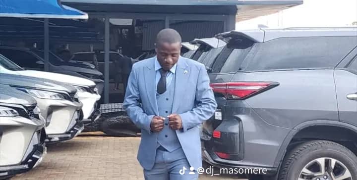 DJ Masomere in light blue suit